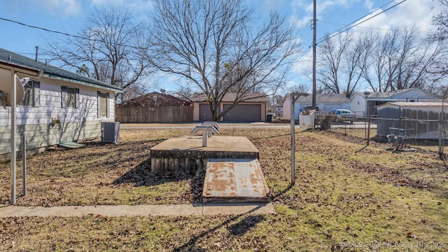 view of yard with central AC unit