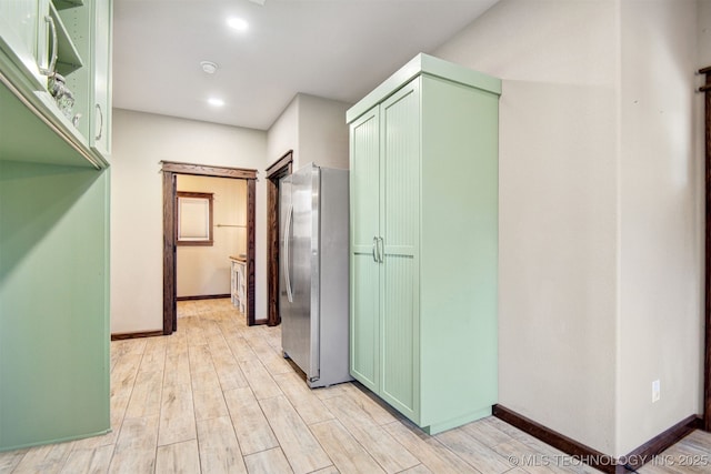 hall with light hardwood / wood-style floors