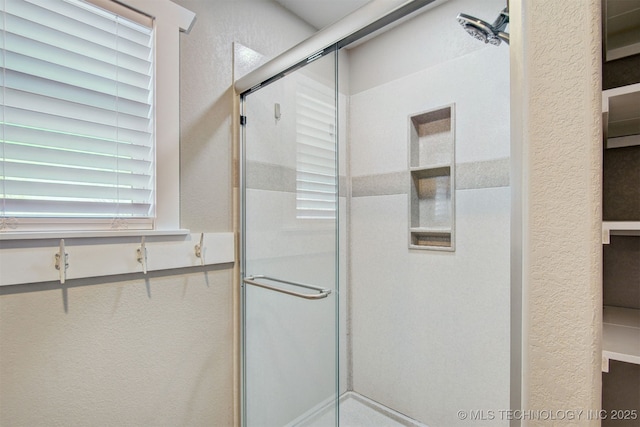 bathroom featuring walk in shower