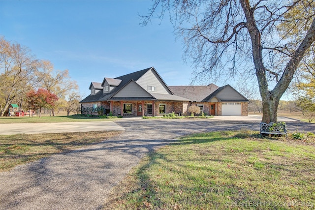 view of front of house with a garage and a front yard