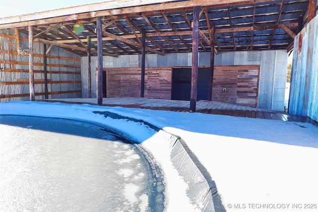 view of pool featuring an outbuilding