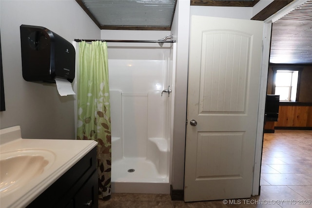 bathroom featuring vanity, tile patterned floors, and a shower with shower curtain