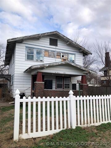 view of property featuring covered porch