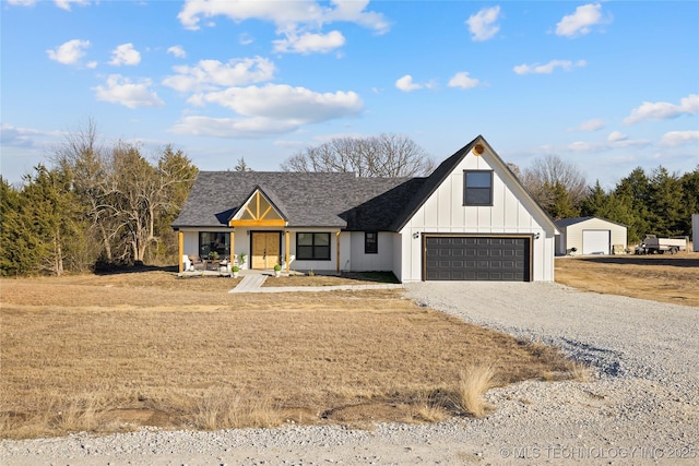 modern farmhouse style home featuring covered porch and a garage