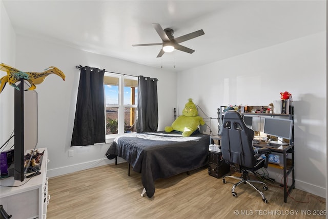 bedroom featuring ceiling fan and light wood-type flooring