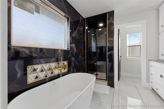 bathroom featuring tile patterned floors, vanity, and plus walk in shower