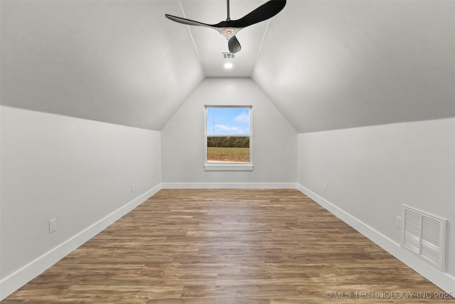 bonus room with hardwood / wood-style floors, ceiling fan, and lofted ceiling