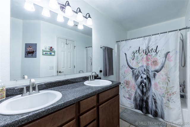 bathroom with vanity and curtained shower