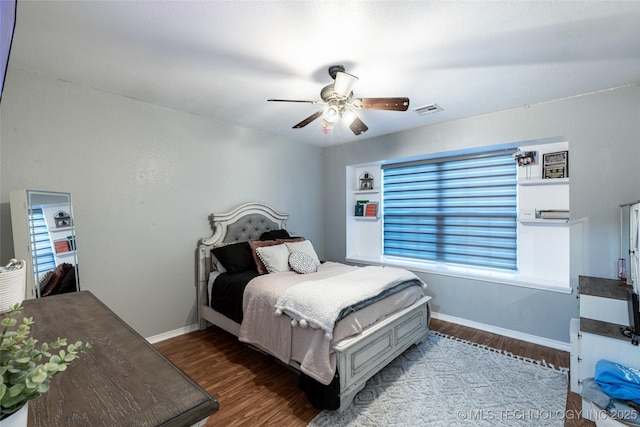 bedroom featuring hardwood / wood-style floors and ceiling fan