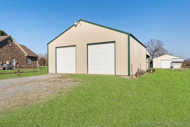 garage with a yard