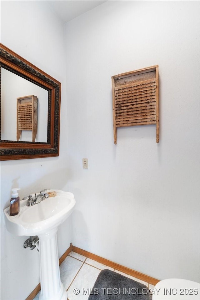 bathroom with tile patterned flooring