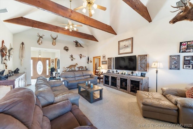 carpeted living room with beamed ceiling, high vaulted ceiling, and ceiling fan