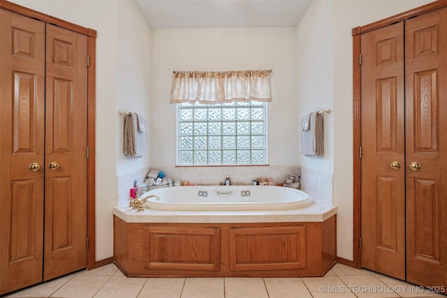 bathroom featuring tile patterned floors and a bathtub