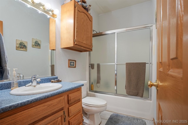 full bathroom with enclosed tub / shower combo, vanity, toilet, and tile patterned flooring