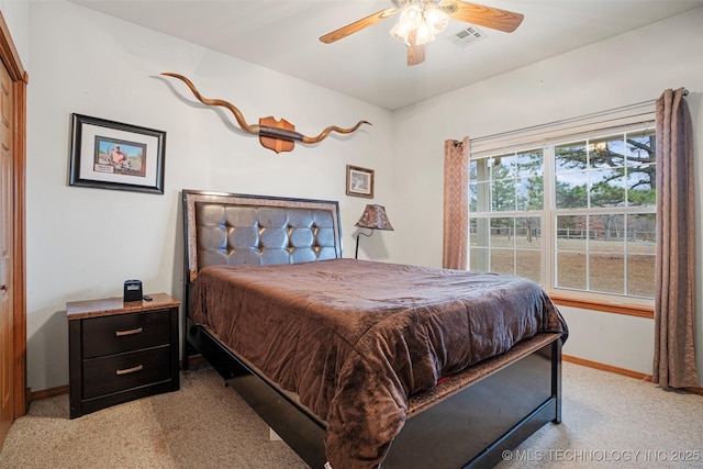 carpeted bedroom featuring ceiling fan