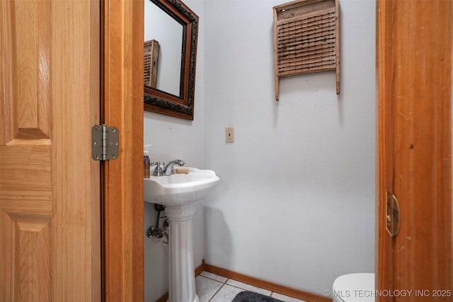 bathroom with tile patterned flooring