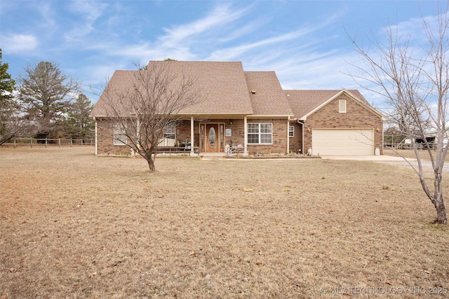 view of front facade featuring a garage and a front lawn