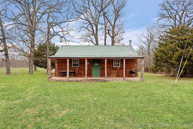 view of outdoor structure featuring a lawn