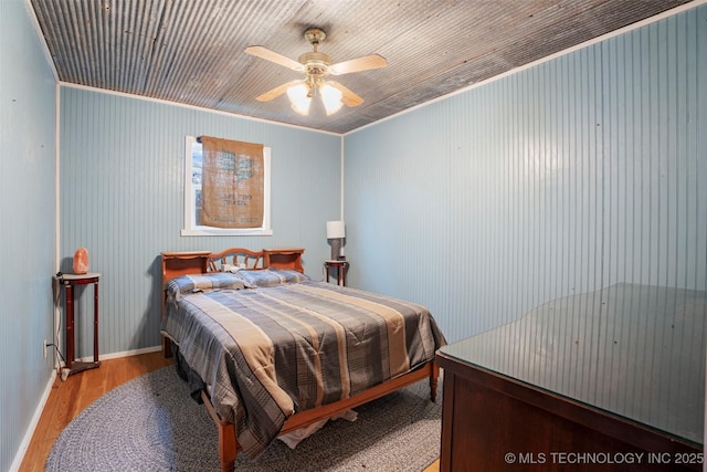 bedroom featuring ceiling fan and light wood-type flooring