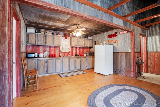 kitchen featuring white refrigerator, ceiling fan, and light wood-type flooring