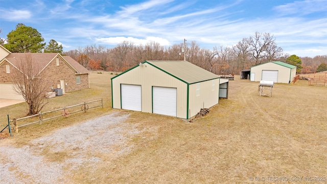 view of outbuilding featuring a garage and a yard