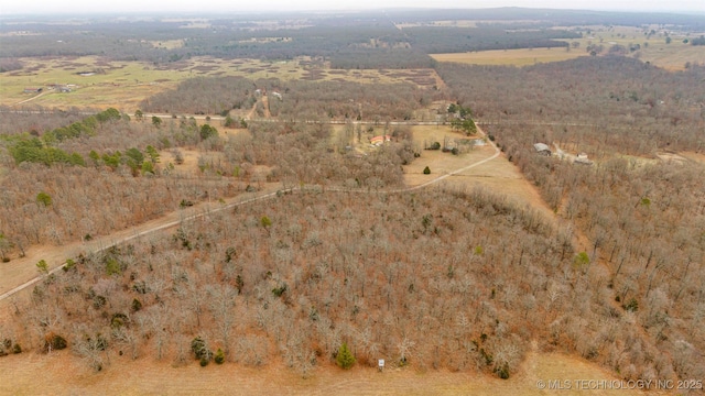 birds eye view of property with a rural view