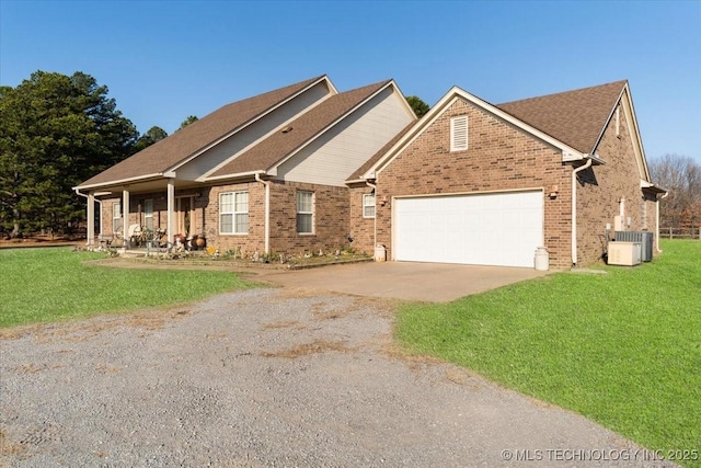 craftsman-style house featuring a garage, covered porch, and a front lawn