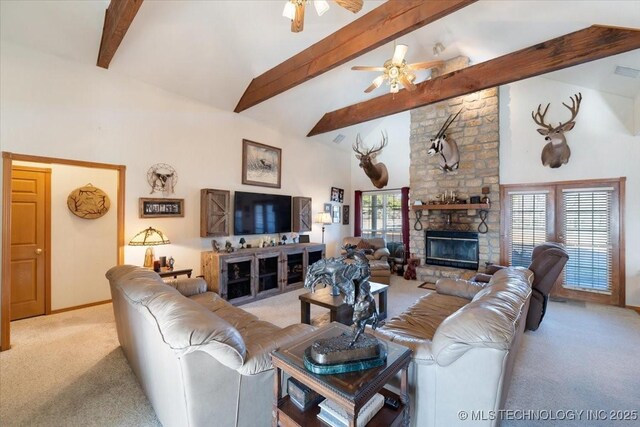 living room featuring a stone fireplace, high vaulted ceiling, ceiling fan, light carpet, and beam ceiling