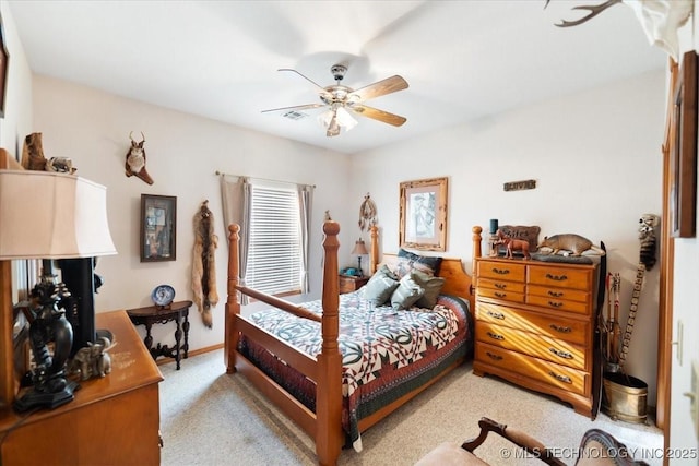 bedroom with light carpet and ceiling fan