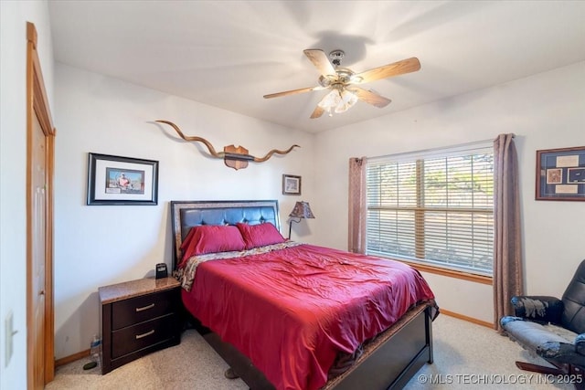 bedroom featuring ceiling fan and light colored carpet