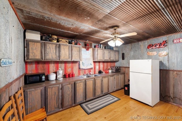 kitchen with sink, wood ceiling, light wood-type flooring, white refrigerator, and ceiling fan