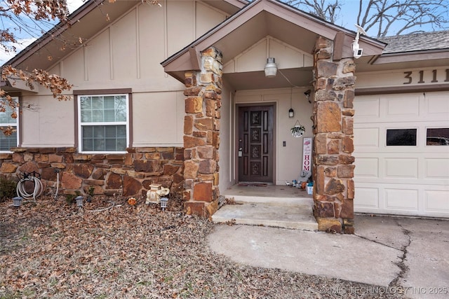 view of exterior entry featuring a garage