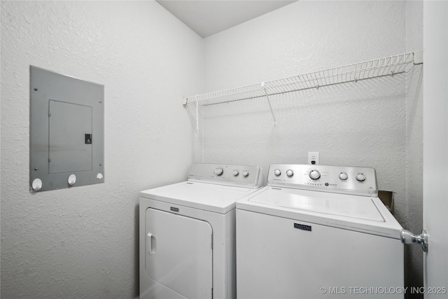 washroom with washer and dryer and electric panel