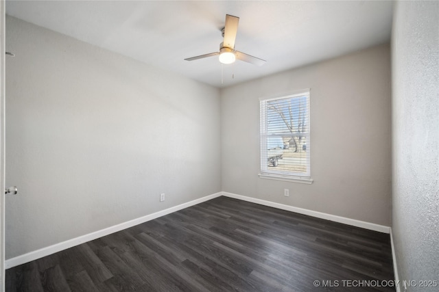 unfurnished room with ceiling fan and dark hardwood / wood-style floors