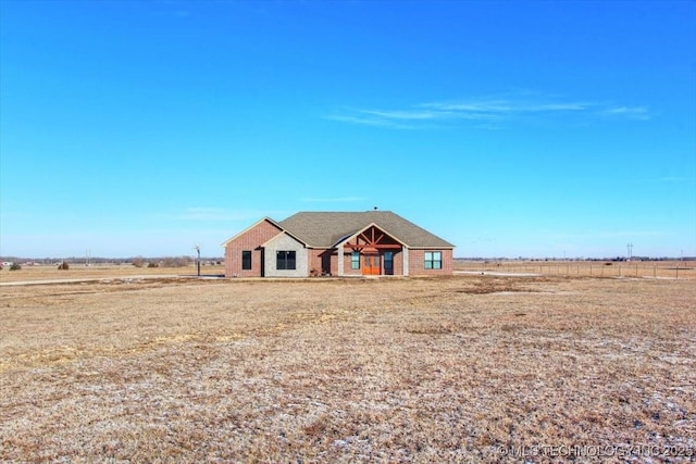 ranch-style house with a rural view