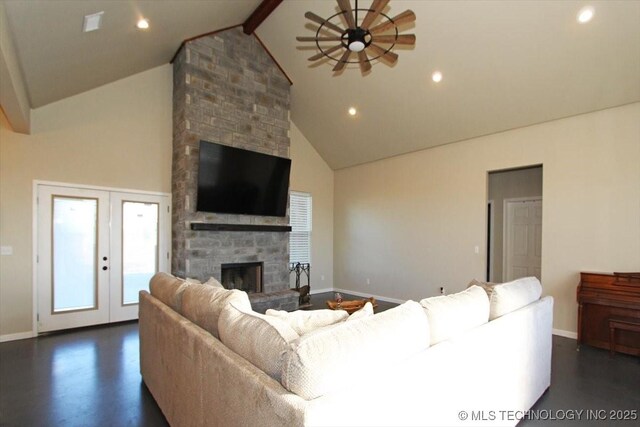 living room with french doors, ceiling fan, lofted ceiling with beams, a fireplace, and dark hardwood / wood-style floors