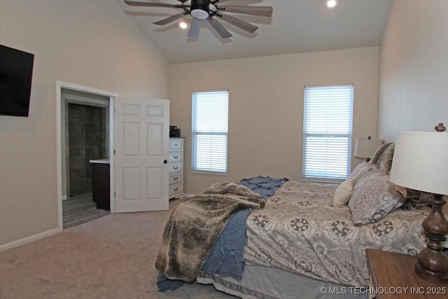 carpeted bedroom featuring ceiling fan, lofted ceiling, and connected bathroom