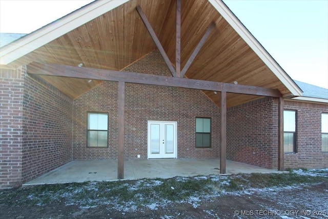 rear view of property featuring french doors and a patio