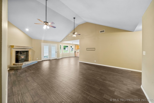 unfurnished living room featuring ceiling fan and lofted ceiling