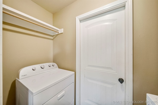 washroom with washer / clothes dryer