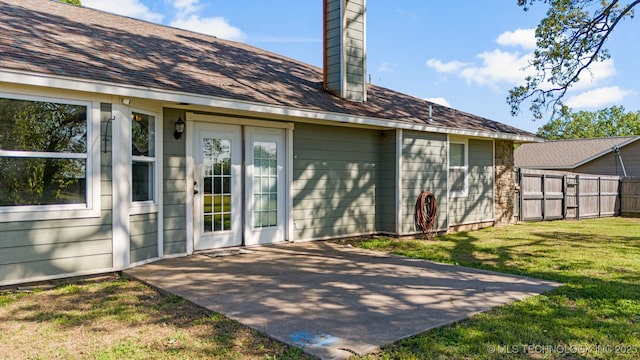 rear view of house with a lawn