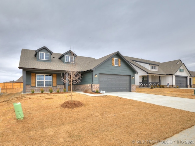 view of front of house featuring a garage and a front lawn