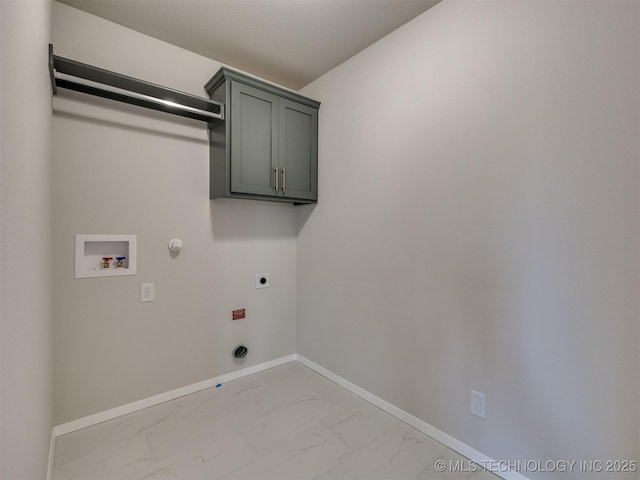 laundry area featuring cabinets, washer hookup, hookup for an electric dryer, and hookup for a gas dryer