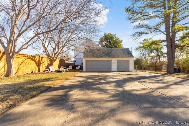 view of property exterior with an outbuilding and a garage