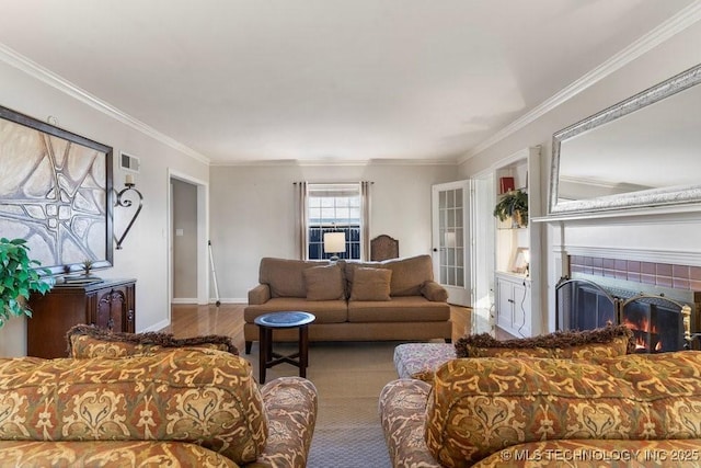 living room with crown molding and hardwood / wood-style flooring