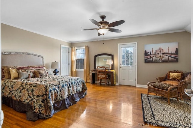 bedroom with ceiling fan, crown molding, and light hardwood / wood-style flooring