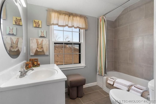 full bathroom featuring tile patterned flooring, shower / bath combo with shower curtain, vanity, and toilet