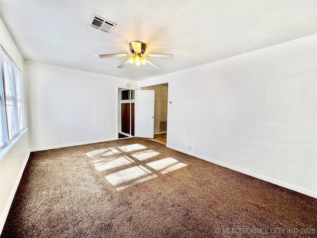 empty room featuring ceiling fan and carpet floors