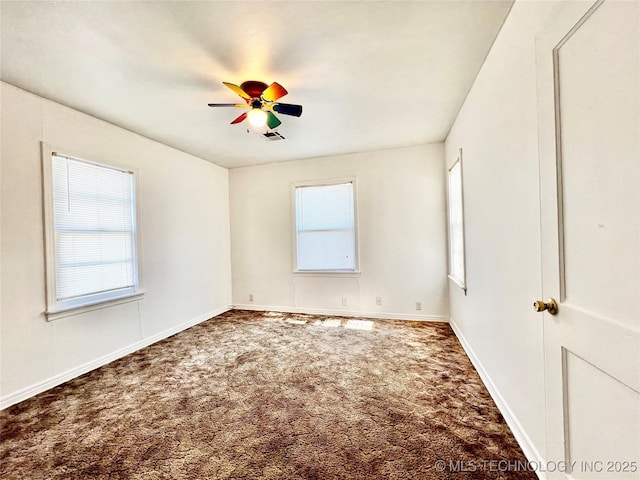 unfurnished room with ceiling fan and carpet floors