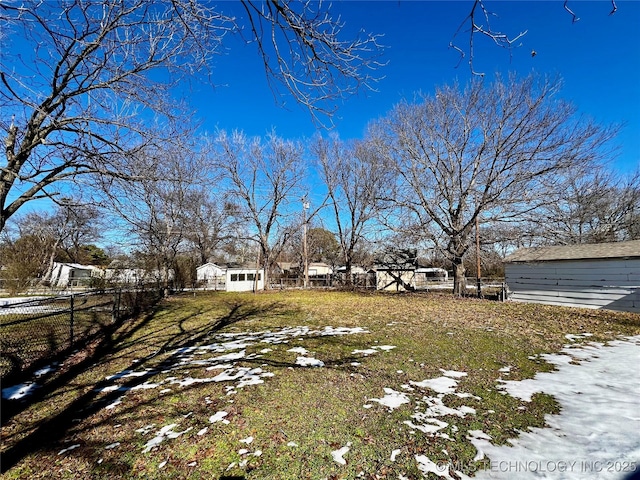 view of yard layered in snow